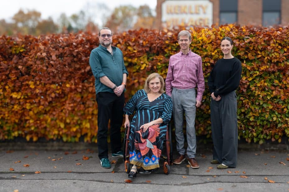 From left to right, Richard, Tracey, Liam and Regina posing in front of a hedge.