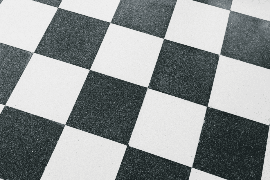 a photo of a black and white tiled floor
